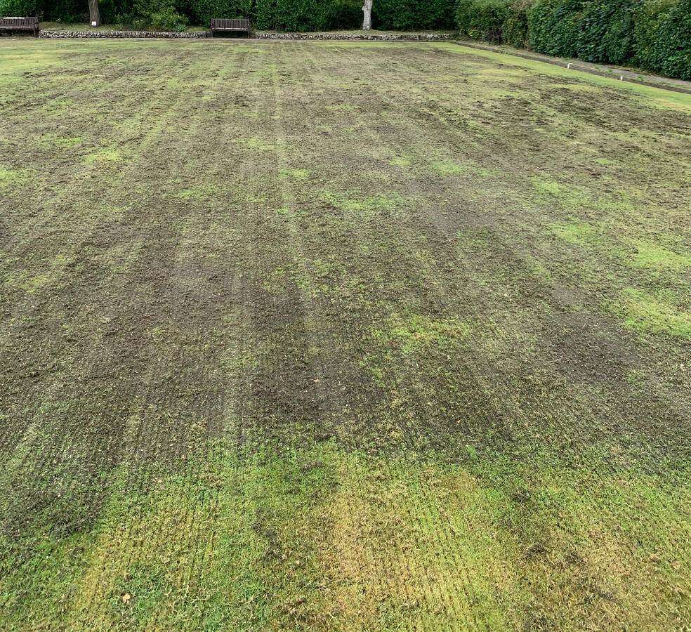 Hitting the thatch and poor areas of growth.